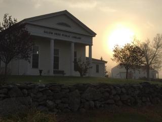 Hazy early morning sun shining at the Salem Free Public Library